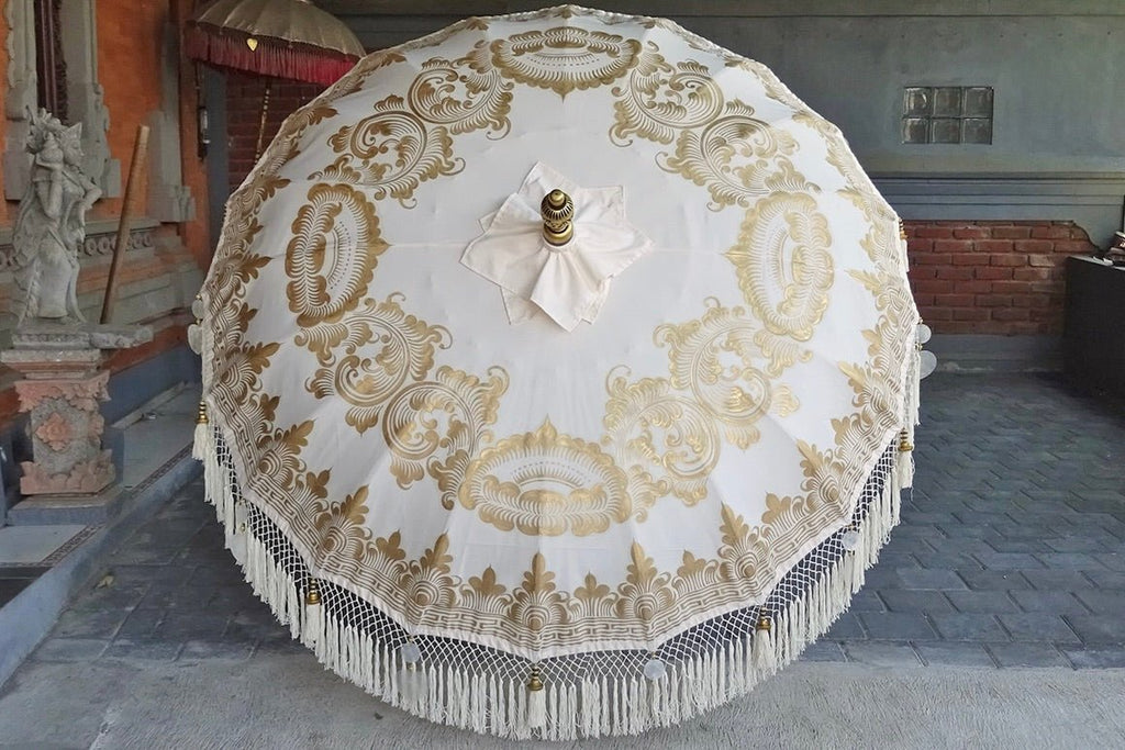 Classic handcrafted Balinese bamboo parasol with hand-painted designs, perfect for garden, patio, and outdoor shade.