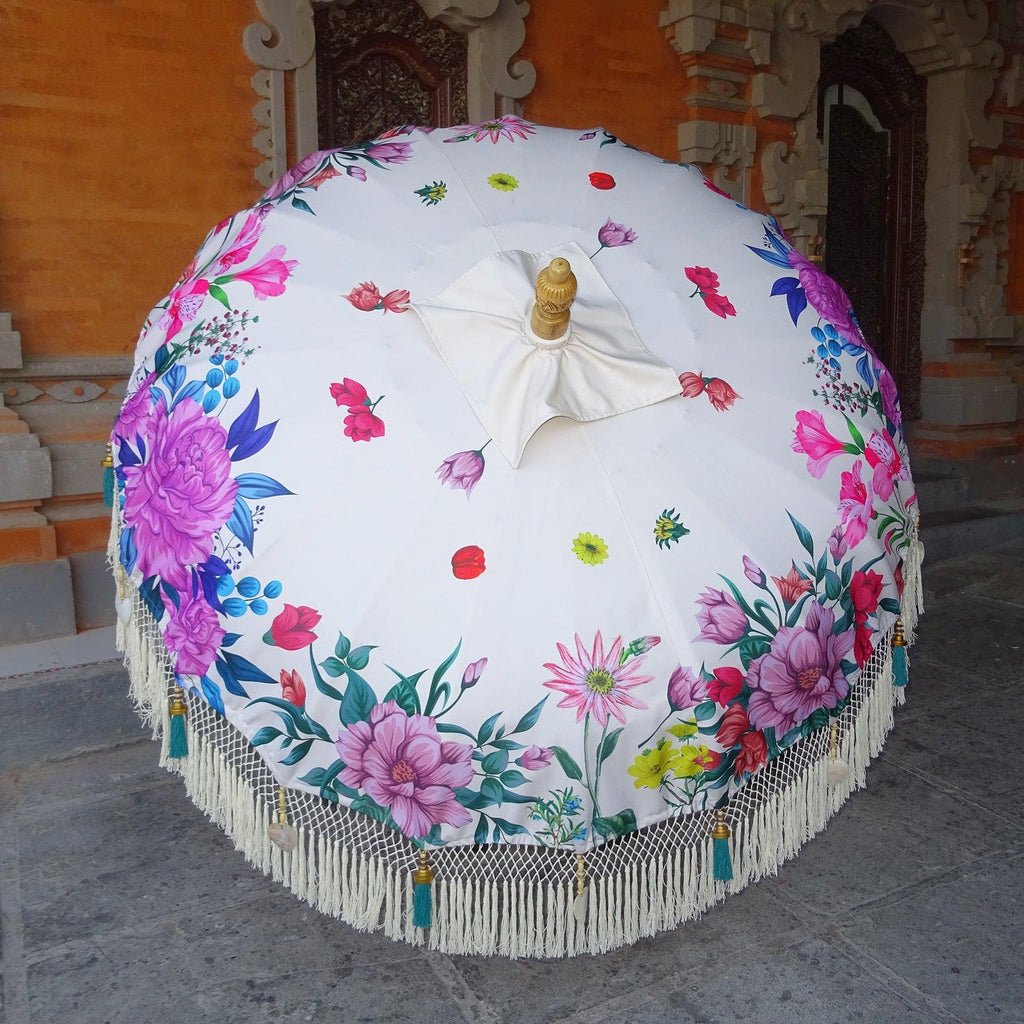 Daisy Parasol creating shade in a bright garden, enhancing the tropical outdoor ambiance.