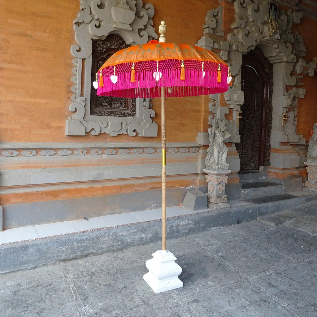 Close-up of the Clementine Parasol’s fringe with pink tassels and delicate heart-shaped seashells.