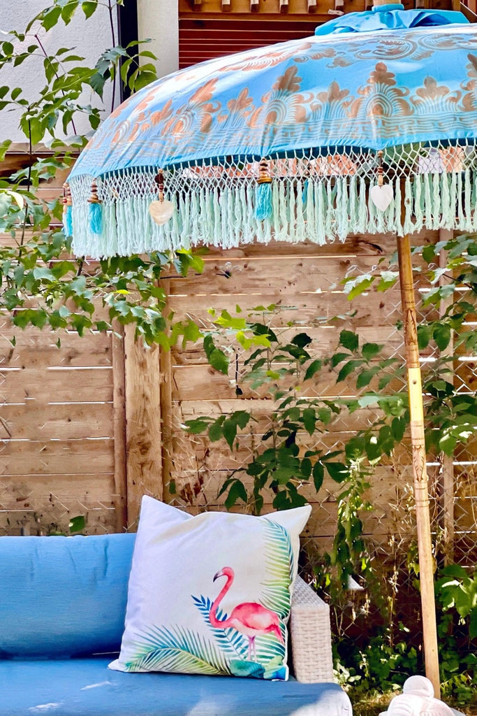 Big Jack Parasol with bold turquoise canvas and gold hand-painted details, perfect for stylish outdoor spaces.