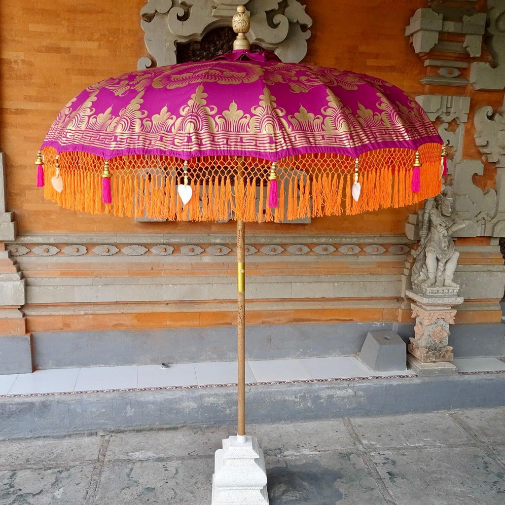 Cecilia Parasol adding vibrant color and elegance to a stylish outdoor patio or garden setting.