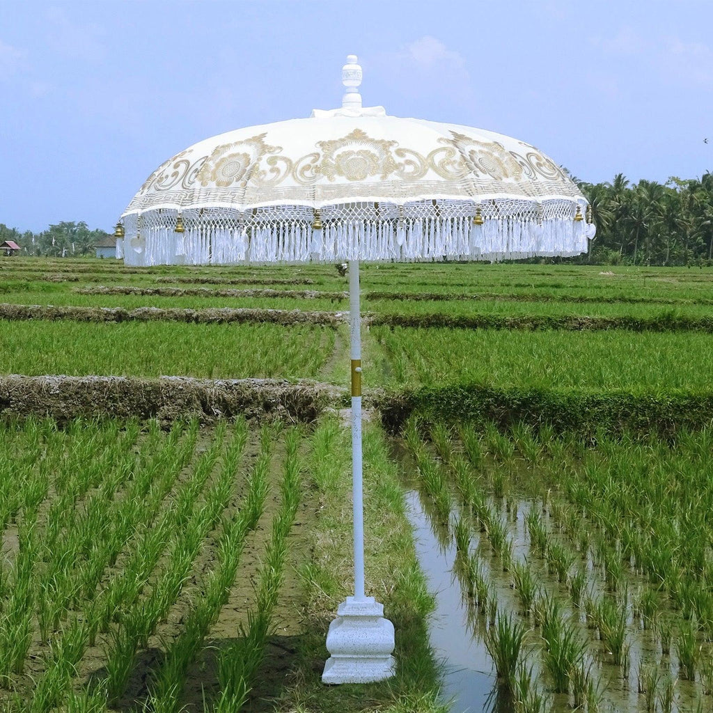 Overhead view of the Ally Parasol in white and gold with decorative fringes—perfect for stylish outdoor spaces.