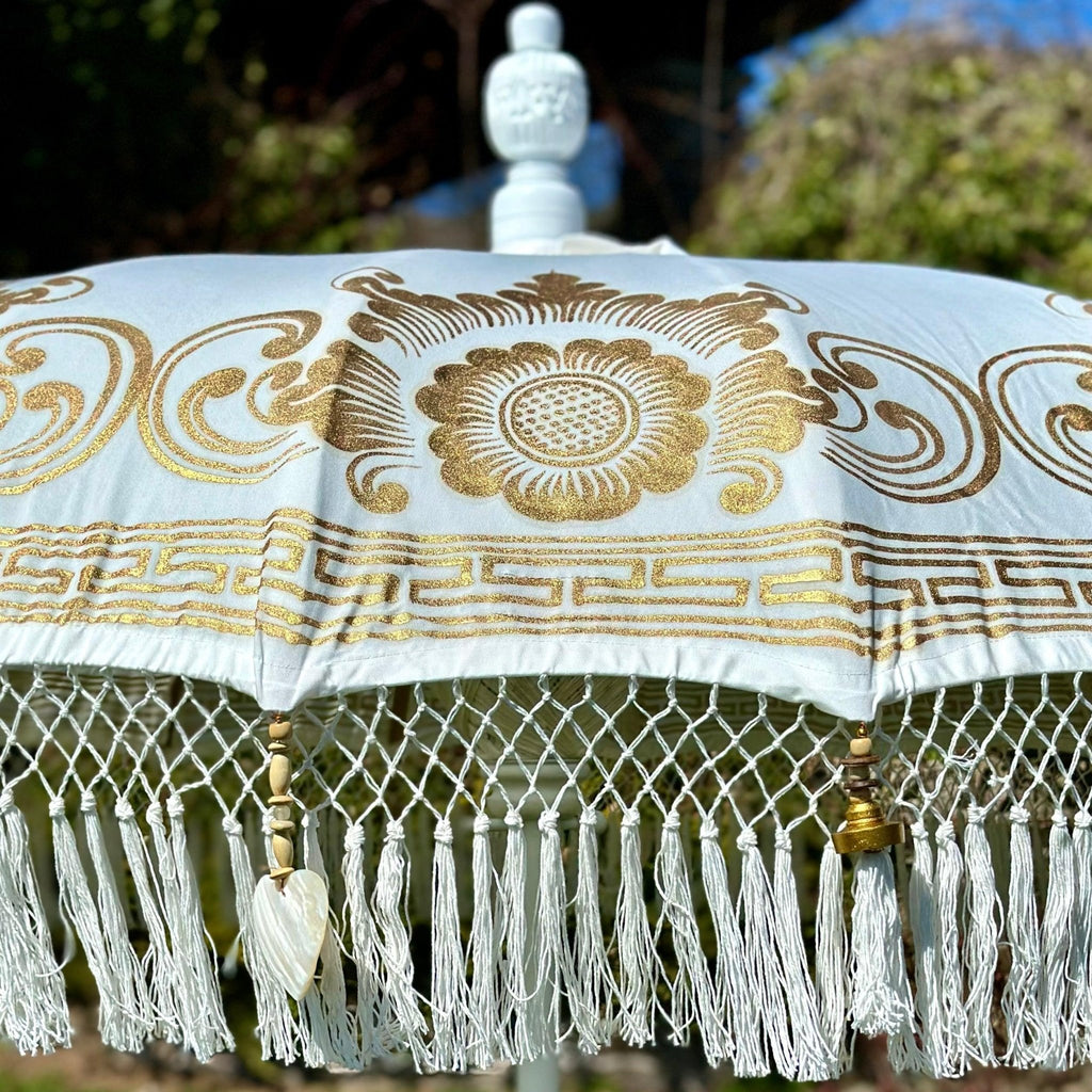Detailed gold artwork on the Ally Parasol, blending luxury design with artisanal craftsmanship.